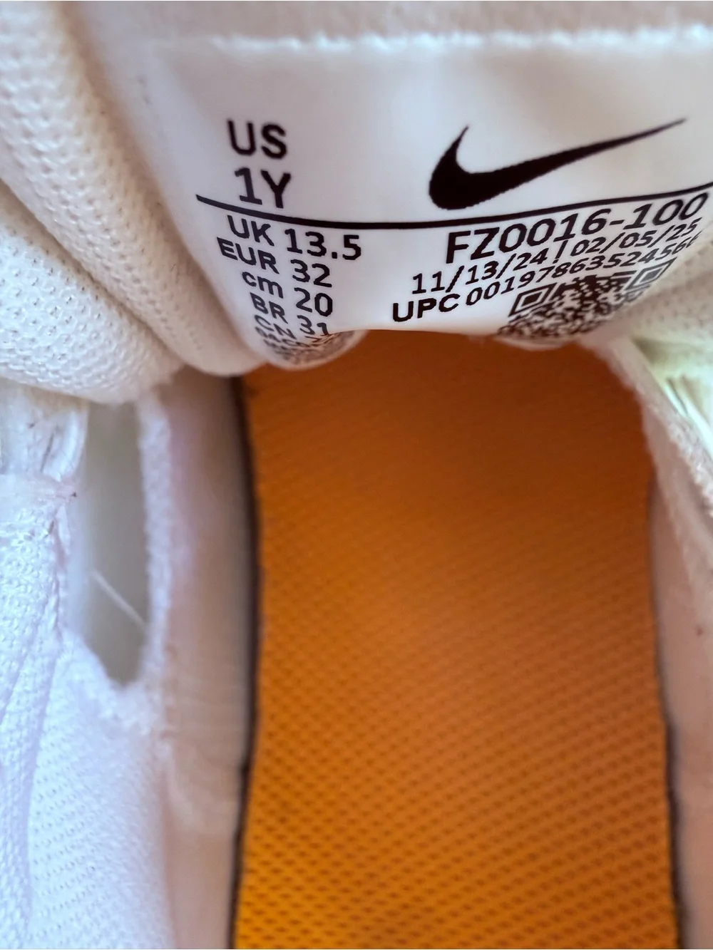 Nike Kids White Sneakers with Orange Toe and Blue Accents